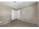 This bedroom has neutral walls and carpet, and a closet for storage at 6377 W Haleh Ave, Las Vegas, NV 89141