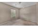Simple bedroom with neutral walls, carpet, and a single window at 6377 W Haleh Ave, Las Vegas, NV 89141