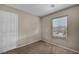 This bedroom has neutral walls, carpet and natural light from the window at 6377 W Haleh Ave, Las Vegas, NV 89141