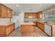 Bright kitchen featuring wood cabinets, an island, modern appliances, and ample counter space for meal preparation at 6377 W Haleh Ave, Las Vegas, NV 89141