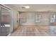 Bright living space with sliding glass doors to the backyard, tiled floor, and natural lighting at 6377 W Haleh Ave, Las Vegas, NV 89141