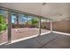 Covered outdoor patio with desert landscaping and framed view of the neighboring houses at 6377 W Haleh Ave, Las Vegas, NV 89141