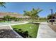 A lush community park complete with mature trees, green spaces, and a playground at 6433 Farness St, Las Vegas, NV 89135