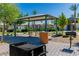 Community BBQ area with picnic tables and well-maintained landscaping at 6953 Midnight Bronze St, North Las Vegas, NV 89086