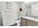 Bright bathroom featuring a shower, modern vanity, and neutral decor at 6953 Midnight Bronze St, North Las Vegas, NV 89086