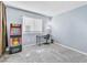 Bedroom with a desk, chair, and arcade game at 6953 Midnight Bronze St, North Las Vegas, NV 89086