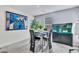 Cozy dining area with modern table set, decorative art, and a large aquarium at 6953 Midnight Bronze St, North Las Vegas, NV 89086