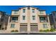 Attractive two-story townhome features a modern design with a private balcony and a garage at 6953 Midnight Bronze St, North Las Vegas, NV 89086