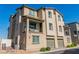 Beautiful stucco townhome features a balcony, manicured landscaping, and an attached garage at 6953 Midnight Bronze St, North Las Vegas, NV 89086