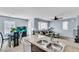 Open kitchen overlooking the living area, featuring granite counters and stainless steel appliances at 6953 Midnight Bronze St, North Las Vegas, NV 89086