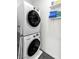 Modern laundry room featuring a stacked washer and dryer at 6953 Midnight Bronze St, North Las Vegas, NV 89086