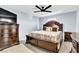 Well-lit primary bedroom featuring a large bed, dresser, and bedside tables at 6953 Midnight Bronze St, North Las Vegas, NV 89086