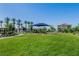 Community playground with a large grassy area, perfect for families with children at 6953 Midnight Bronze St, North Las Vegas, NV 89086