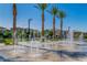 Beautiful water feature surrounded by palm trees and well-maintained landscaping at 6953 Midnight Bronze St, North Las Vegas, NV 89086