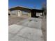 Modest single-story home with covered parking area and basic landscaping at 709 G St, Las Vegas, NV 89106