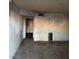 Living room needing renovation, featuring damaged walls and floors at 709 G St, Las Vegas, NV 89106