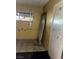 A room with damage: a displaced door, peeling walls, and a broken window grate at 709 G St, Las Vegas, NV 89106