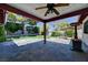 The covered back patio offers shade and plenty of space to entertain guests at 7100 Carrondale Way, Las Vegas, NV 89128