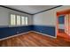 Small bedroom featuring hardwood floors, plantation shutters and custom trim at 7100 Carrondale Way, Las Vegas, NV 89128