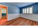 Quaint bedroom featuring hardwood floors, plantation shutters, and custom trim at 7100 Carrondale Way, Las Vegas, NV 89128