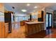 Bright open kitchen featuring wood cabinets, an island, and natural lighting at 7100 Carrondale Way, Las Vegas, NV 89128