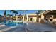 Inviting community pool with lounge chairs, shaded cabanas, and well-kept surroundings at 7395 Howell Mill Ct, Las Vegas, NV 89113