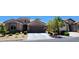 Charming single-story home with a well-manicured front yard and a two-car garage at 7395 Howell Mill Ct, Las Vegas, NV 89113