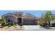 Charming single-story home featuring a two-car garage, desert landscaping, and a tile roof in a well-kept neighborhood at 7395 Howell Mill Ct, Las Vegas, NV 89113