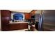 Well-equipped kitchen featuring stainless steel appliances, rich wood cabinetry, and granite countertops at 7395 Howell Mill Ct, Las Vegas, NV 89113