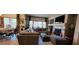 Comfortable living room with fireplace and backyard view at 7395 Howell Mill Ct, Las Vegas, NV 89113