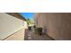 Well-maintained side yard with rock landscaping, stepping stones, and privacy shrubs at 7395 Howell Mill Ct, Las Vegas, NV 89113