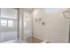Bright bathroom features a large shower, built-in shelves and a built in bench at 769 Cloud Creek St, Henderson, NV 89011