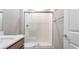 Modern bathroom with glass enclosed tiled shower and a single sink vanity at 769 Cloud Creek St, Henderson, NV 89011