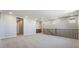 Expansive bonus room with neutral walls and carpet featuring staircase and views of exterior at 769 Cloud Creek St, Henderson, NV 89011