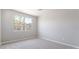 Bright bedroom with large window offering natural light and neutral carpet flooring at 769 Cloud Creek St, Henderson, NV 89011