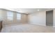 Spacious bedroom with neutral walls and carpet and large windows providing an abundance of light at 769 Cloud Creek St, Henderson, NV 89011