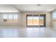 Large living area featuring tile flooring, lots of natural light, and access to outdoor patio at 769 Cloud Creek St, Henderson, NV 89011