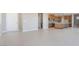 Bright, open living space features tile flooring, modern kitchen and a welcoming front door at 769 Cloud Creek St, Henderson, NV 89011