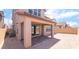 Covered patio with brick flooring with outdoor access via large sliding glass doors and surrounding block wall at 769 Cloud Creek St, Henderson, NV 89011