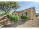 Exterior features backyard with gravel and desert landscaping at 7916 Lyrebird Dr, North Las Vegas, NV 89084