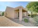 Exterior of home featuring a covered patio and low maintenance yard at 7916 Lyrebird Dr, North Las Vegas, NV 89084