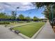 Bocce Ball court featuring a beautifully landscaped green space and convenient shaded seating areas at 7916 Lyrebird Dr, North Las Vegas, NV 89084