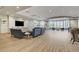 The clubhouse room features wood floors, comfortable seating and a serene desert view at 7916 Lyrebird Dr, North Las Vegas, NV 89084