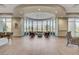 Sunlit Clubhouse with comfortable seating, desert views, and stylish interior design at 7916 Lyrebird Dr, North Las Vegas, NV 89084