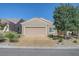 Charming single-story home with a two-car garage, desert landscaping, and a well-maintained front yard at 7916 Lyrebird Dr, North Las Vegas, NV 89084