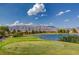 Green golf course overlooking a large pond at 7916 Lyrebird Dr, North Las Vegas, NV 89084
