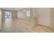Open-concept living area with tile flooring and sliding glass doors to outdoor space at 7916 Lyrebird Dr, North Las Vegas, NV 89084