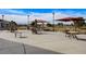 Inviting outdoor patio with comfortable seating, shade umbrellas and an expansive desert landscape at 7916 Lyrebird Dr, North Las Vegas, NV 89084