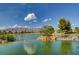 Scenic pond view with mountains and blue sky in the background at 7916 Lyrebird Dr, North Las Vegas, NV 89084