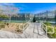 Outdoor tennis courts feature durable fencing, accessible ramp, and beautifully maintained surroundings at 7916 Lyrebird Dr, North Las Vegas, NV 89084